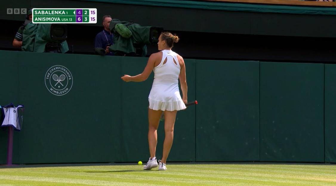 Aryna Sabalenka on a tennis court.