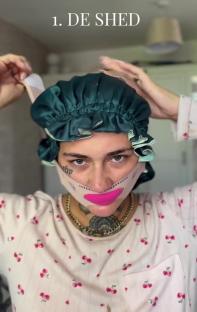 Person putting on a silk hair bonnet and face mask.