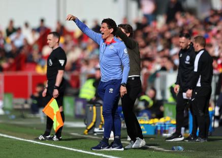 Brentford coach Keith Andrews giving instructions on the touchline.