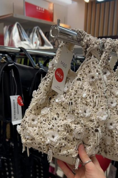 Hand-embellished cream handbag on sale at M&S.