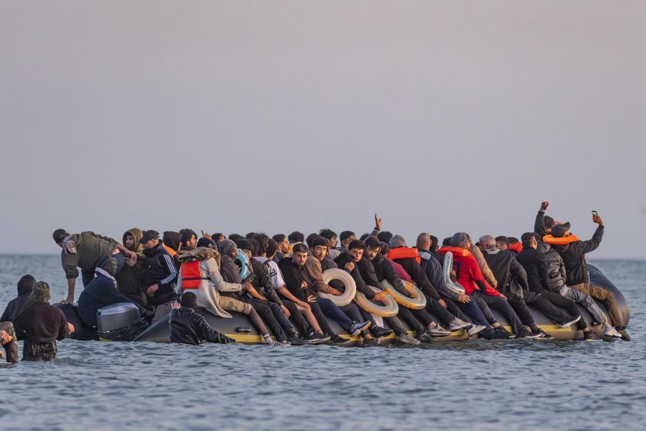 Migrants in a small boat crossing the English Channel.
