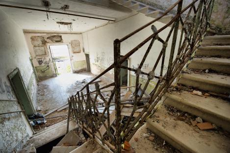 Ruined staircase in an abandoned building.