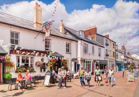 Shoppers and tourists on Old Fore Street in Sidmouth, beside The Anchor Inn.