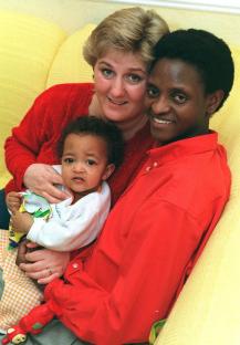 Masai warrior Daniel Lekimenju with his wife and daughter.