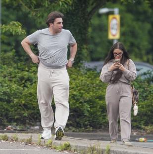 Jack Fincham and Chloe Brockett walking together.