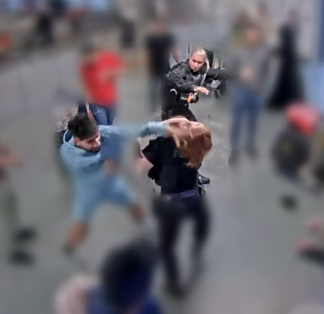 A blurry photo of a fight in an airport.