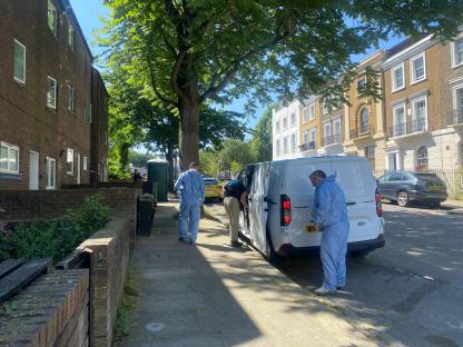 Police investigators at a crime scene.