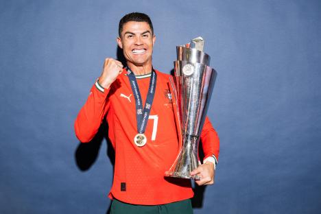 Cristiano Ronaldo holding the UEFA Nations League trophy.