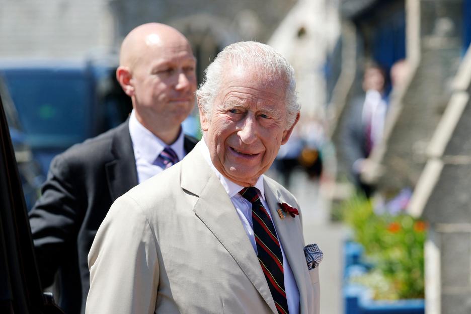 King Charles III arriving at a lifeboat station.