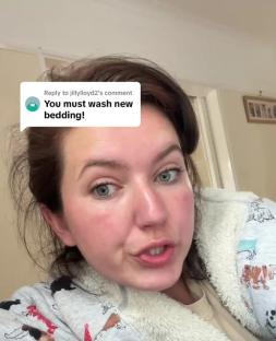 Woman in a robe responds to a comment that says