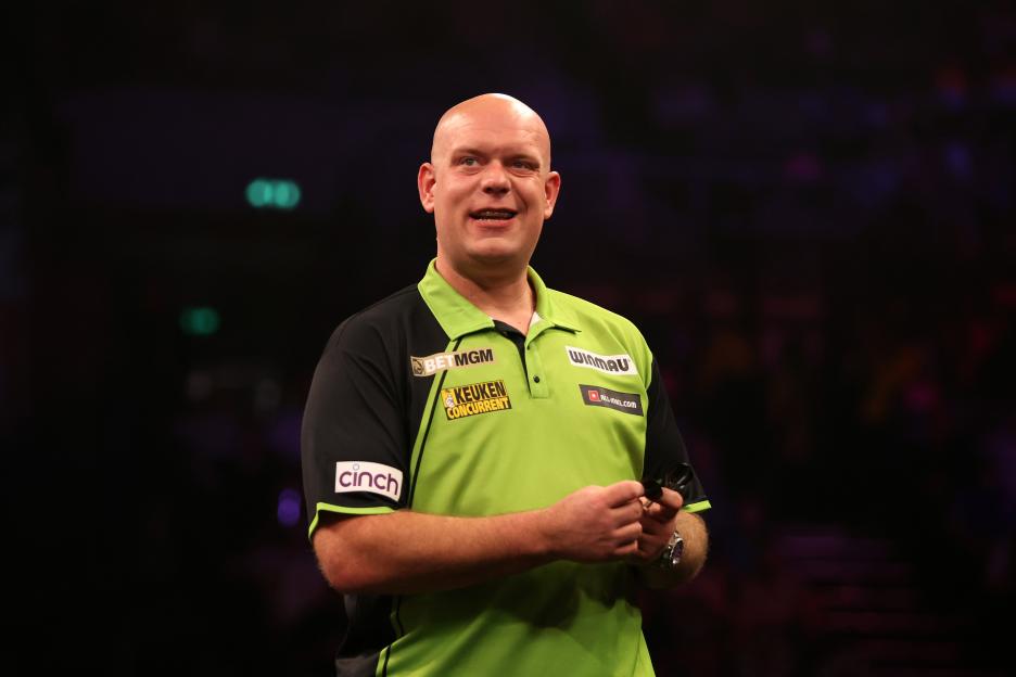 Michael van Gerwen of the Netherlands reacts during a darts match.