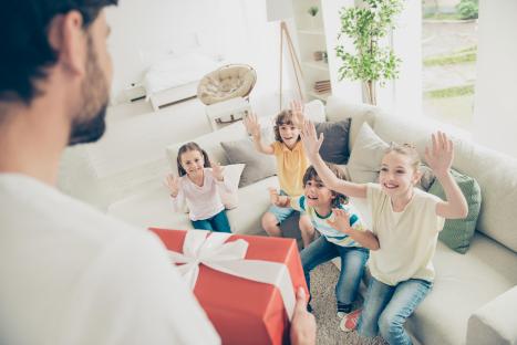 Excited children anticipating a gift.