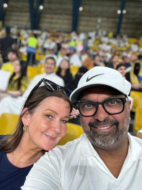 Selfie of a couple at a sporting event.