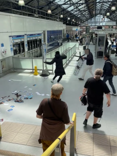 Chaos at Earls Court Station; a man is pursued by a thief.