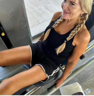 Woman using leg press machine at the gym.