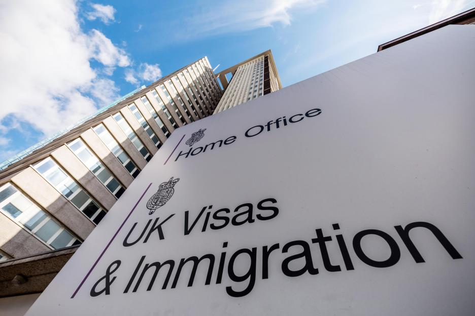 UK Visas & Immigration Home Office sign.