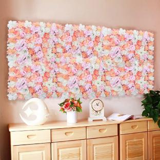 Artificial flower wall panel in pink and white.