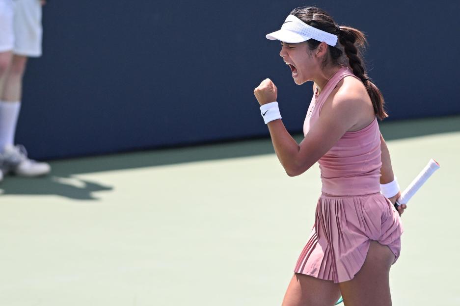 Emma Raducanu celebrating during a tennis match.