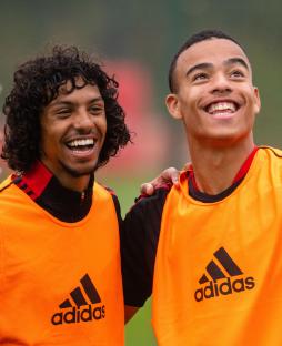 Manchester United's D'Mani Bughail-Mellor and Mason Greenwood at a training session.
