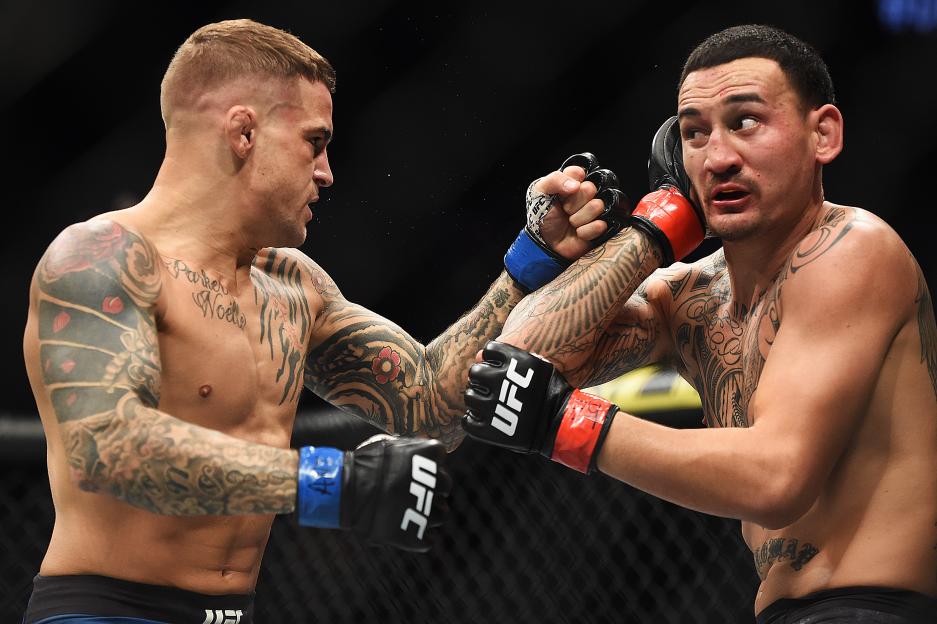 ATLANTA, GEORGIA - APRIL 13: Dustin Poirier punches Max Holloway during the UFC 236 event at State Farm Arena on April 13, 2019 in Atlanta, Georgia. (Photo by Logan Riely/Getty Images)