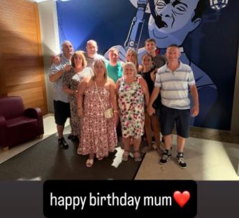 Group photo of family celebrating a birthday.