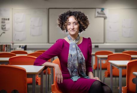 Katharine Birbalsingh CBE, teacher and education reformer, sitting in a classroom.