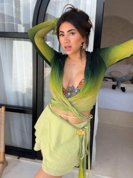Awhina from Married at First Sight wearing a green ombre wrap top and skirt.