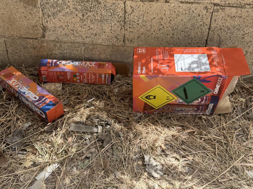 Discarded nitrous oxide canisters on the ground.