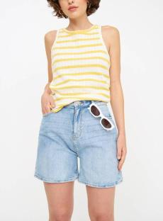 Woman wearing light denim shorts and a yellow and white striped tank top.