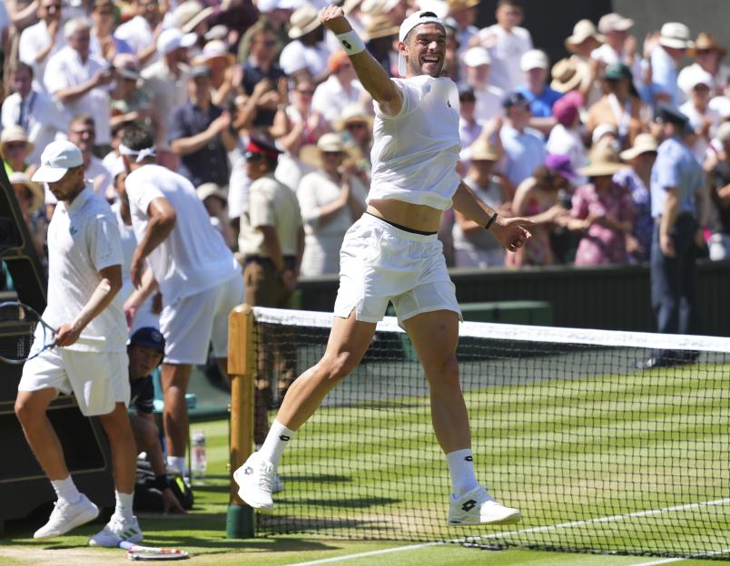 Julian Cash of Britain celebrates a men's doubles win at Wimbledon.