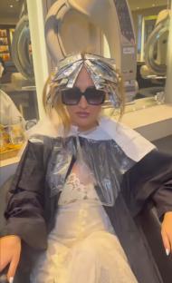 Woman with foil in her hair at a hair salon.
