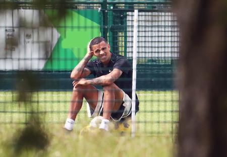 Mason Greenwood sits on the ground during an off-season football training session.