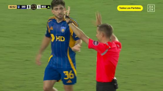 Referee showing a yellow card to a soccer player.