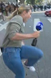 Reporter hit by rubber bullet during protest.