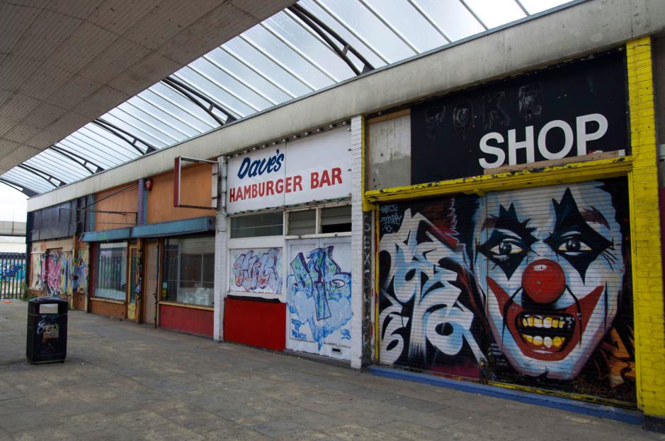 Graffiti-covered shops and Dave's Hamburger Bar in Margate, Kent.