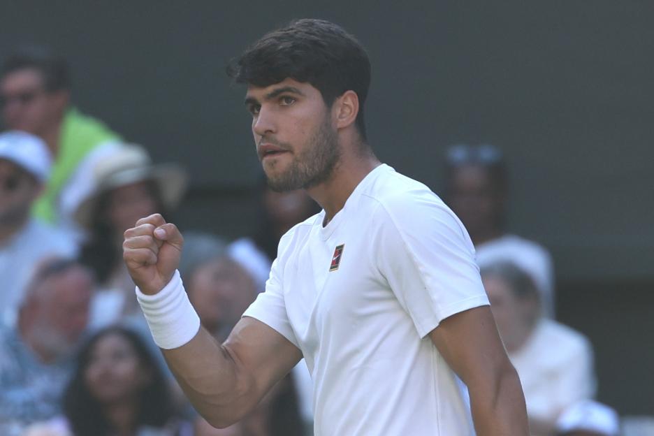 Carlos Alcaraz celebrates during a Wimbledon quarter-final match.