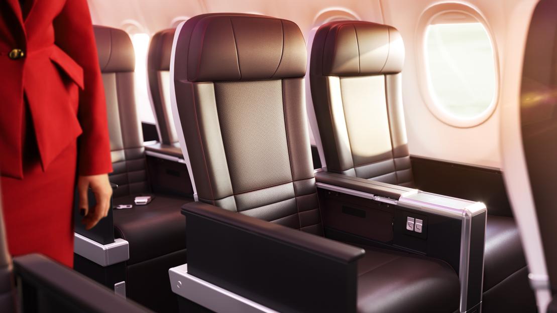 Airplane seats and a flight attendant.