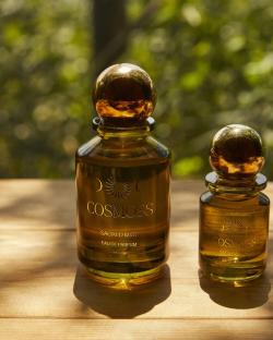 Two bottles of Cosmoss Sacred Mist Eau de Parfum.