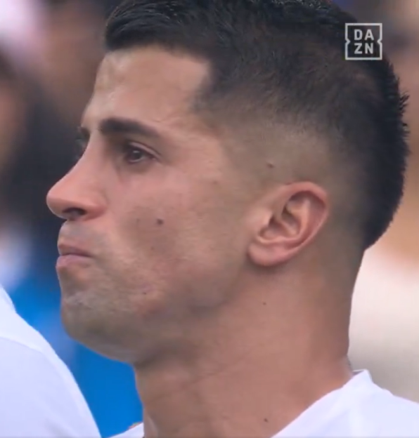 Close-up of João Cancelo looking upset.