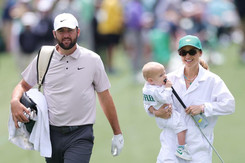 Scottie Scheffler, his wife, and son at a golf tournament.