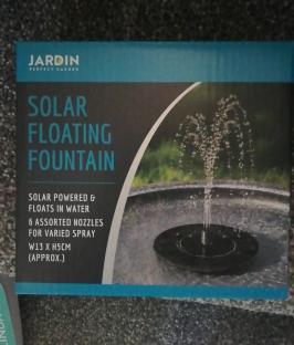 Box showing a solar powered floating fountain.