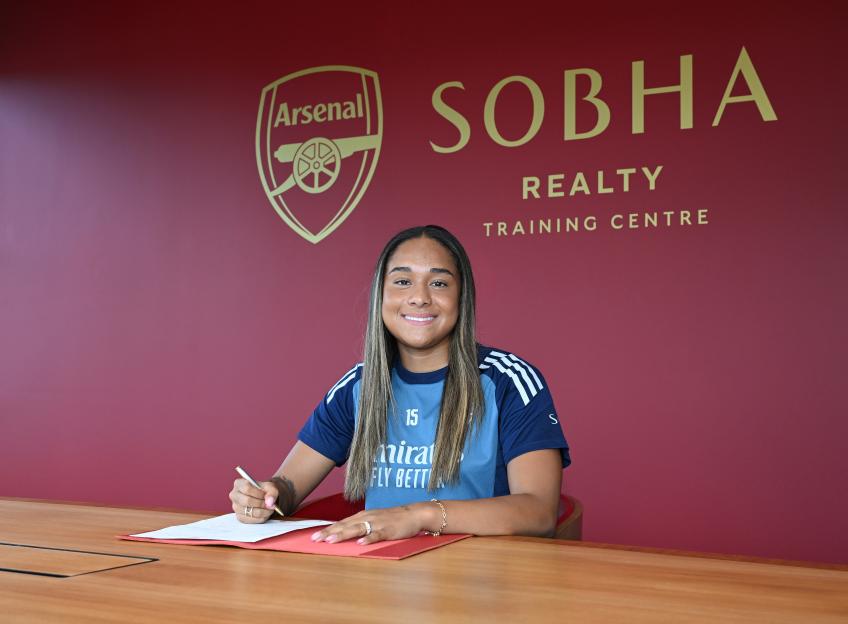 Olivia Smith signing for Arsenal at the Sobha Realty Training Centre.