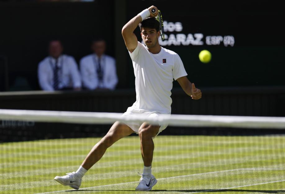 epa12206552 Carlos Alcaraz of Spain in action during the Men's 1st round match against Fabio Fognini of Italy at the Wimbledon Championships, Wimbledon, Britain, 30 June 2025. EPA/TOLGA AKMEN EDITORIAL USE ONLY