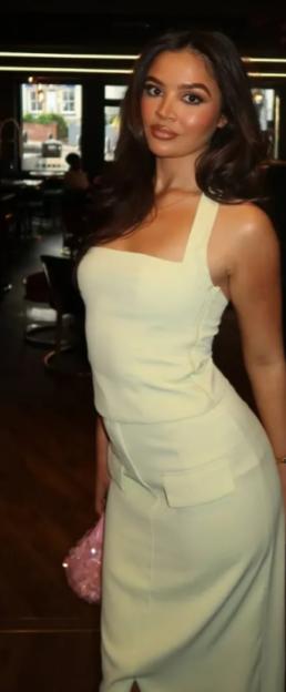 Woman in pale green dress.