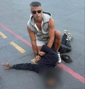 Man making a citizen's arrest of a shoplifter.