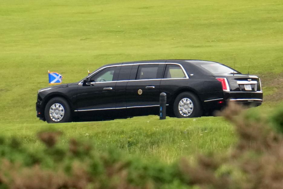 Presidential limousine on a golf course.
