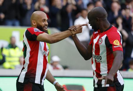 Brentford players Bryan Mbeumo and Yoane Wissa celebrating a goal.