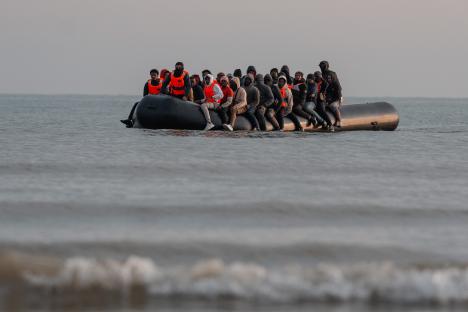 Migrants in a small boat crossing the English Channel.