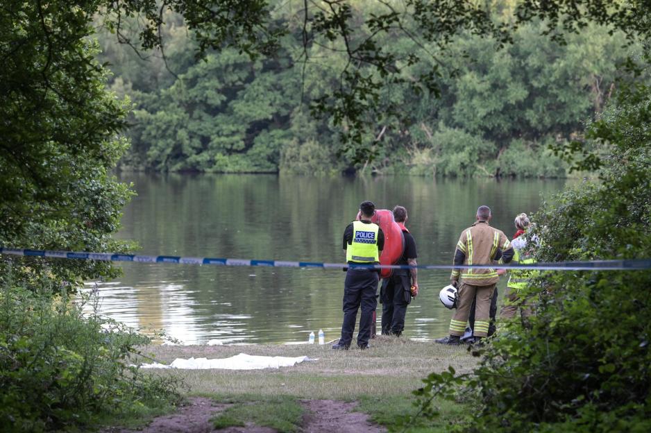 Emergency responders at a lake searching for a missing teen.