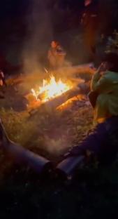 Police raid a nighttime forest ceremony.
